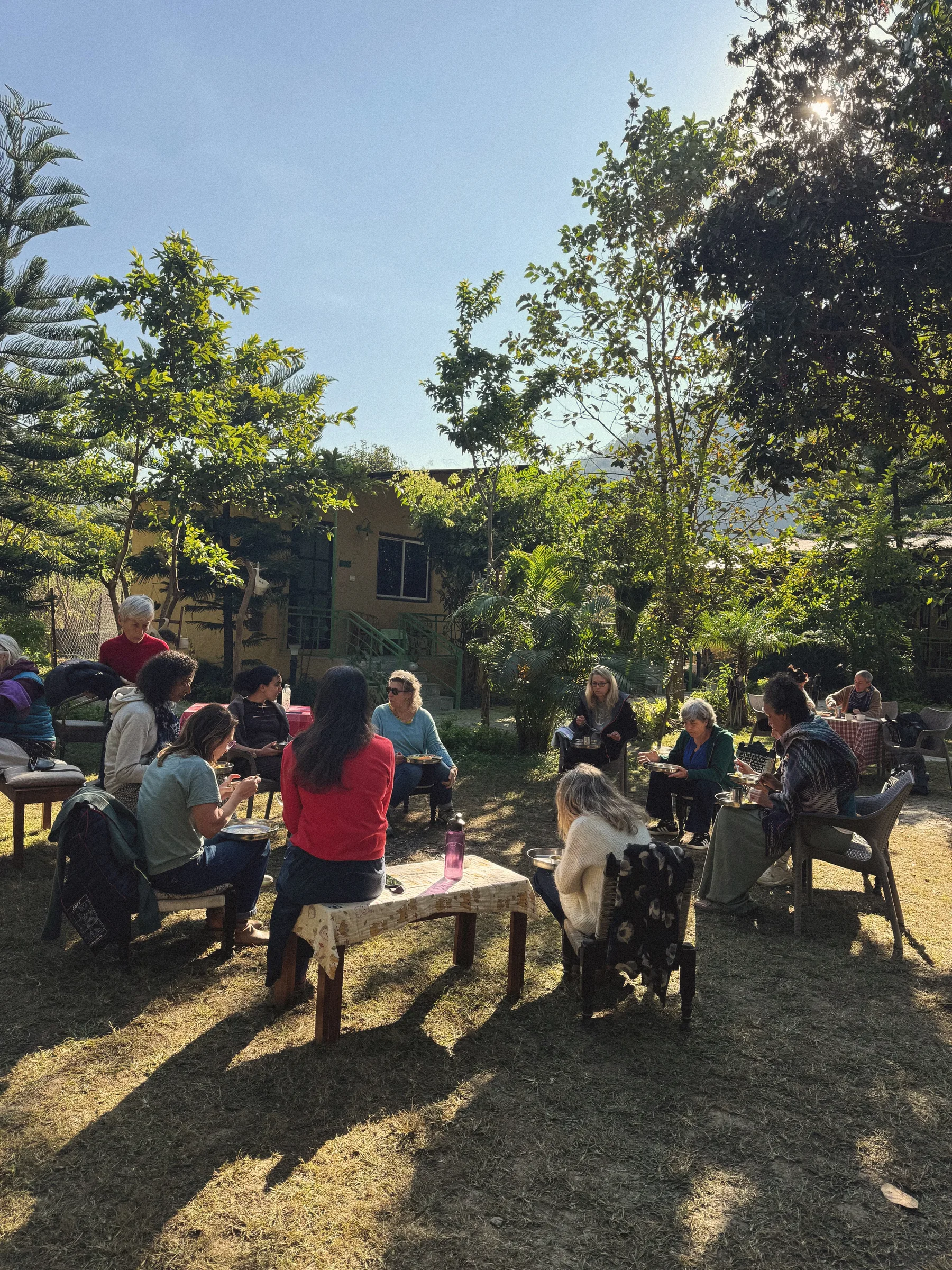 Retreat guests sharing a meal together in the garden