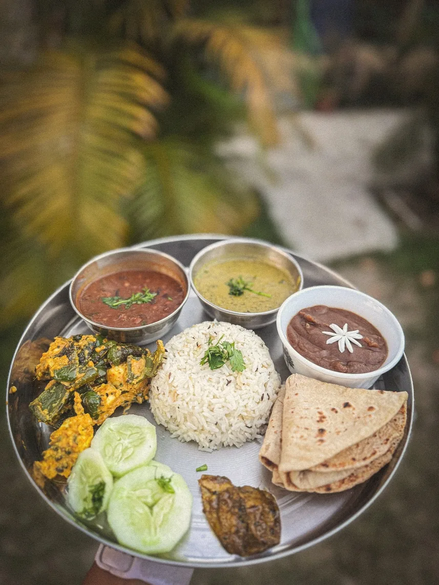 Satvik thali with dal, rice, rotis, sabzi and cucumber