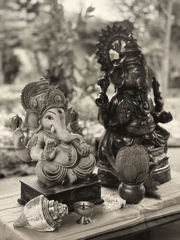 Black and white Ganesha murtis on the altar